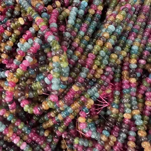 Detailed view of colorful semi-precious tourmaline wheel beads for DIY jewelry making