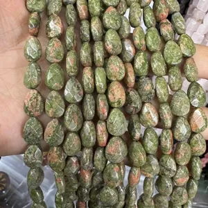 Close-up of faceted tear-drop shaped unakite beads for jewelry making