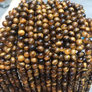 Macro detail of natural A-grade tiger's eye stone beads for DIY jewelry making