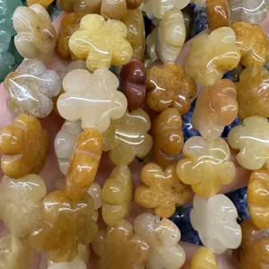 Macro view of natural stone plum blossom flower beads for DIY jewelry making crafts