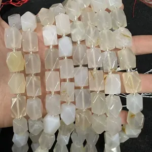 Macro view of faceted octagonal natural milky agate stone beads for DIY jewelry making projects