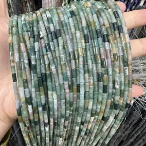 Macro detail of 3x6mm natural green stone cylindrical beads for DIY jewelry making