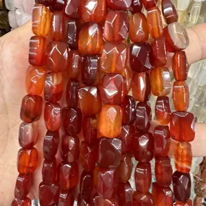 Macro detail of high-quality natural red carnelian agate faceted rectangle beads for DIY