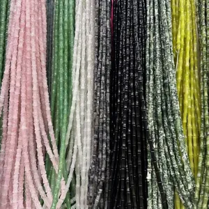 Close-up detail of 5x12mm natural stone bamboo beads in multiple colors for DIY jewelry