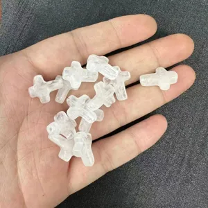 Close-up macro view of 12x16mm white natural stone cross-shaped beads for jewelry