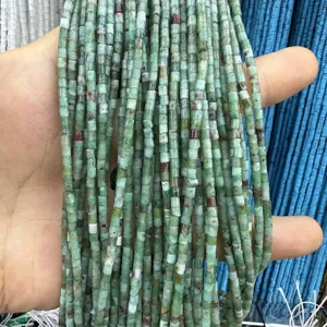 Close-up detail of 2x2mm natural green stone cylindrical tube beads for jewelry making