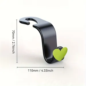 Universal car seat backrest hook with green heart decor, measuring 110x70mm for neat storage.