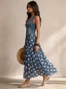 Detailed view of fashionable denim top and polka dot maxi dress, elegant casual summer outfit.