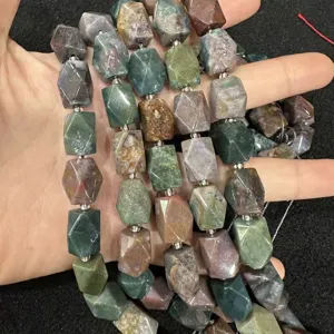 Detailed view of faceted octagonal natural agate stone beads in various earthy colors for DIY