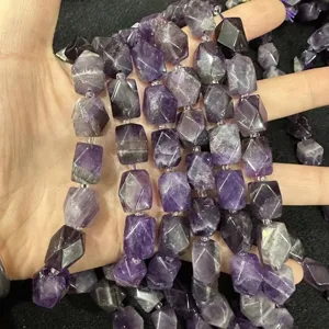 Macro detail of natural purple amethyst faceted rectangular octagon loose beads for DIY jewelry