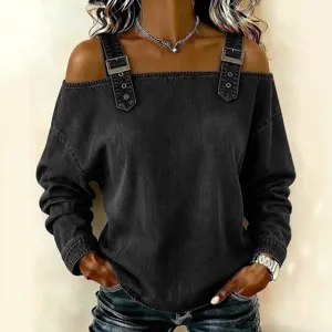 Women's off-shoulder long sleeve denim top with shoulder straps and metal buckle design.