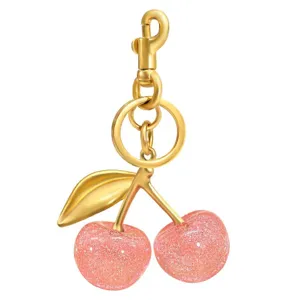 Gold-tone metal and pink crystal glitter cherry keychain detail, luxury bag charm accessory.