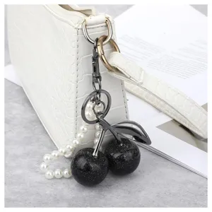 Exquise porte-clés cerise scintillant noir avec sangle de perles, ravissant bijou de sac.