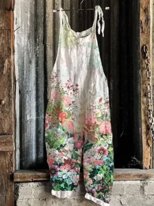 Detailed view of women's vintage floral print sleeveless wide-leg jumpsuit, summer casual apparel.