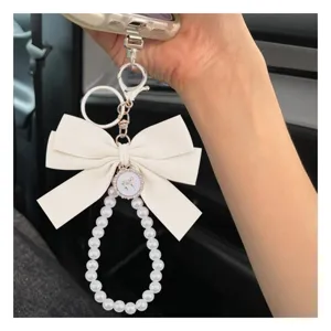 Elegante cinturino per telefono con perle fiocco bianco portachiavi carino donna