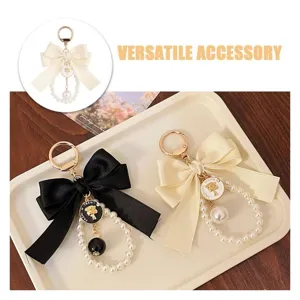Portachiavi con fiocco di perle vintage beige nero anello metallo borsa ciondolo elegante chic