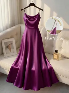 Elegant purple satin evening dress with pearl strap details, perfect for formal events.