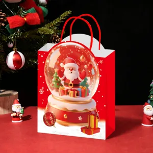 Christmas paper gift bag with cute Santa snow globe print for holiday party packaging and treats.