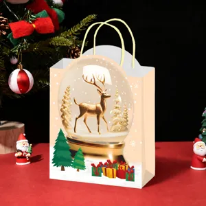 Christmas paper gift bag detail, golden reindeer snow globe design, festive holiday packaging.