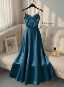 Elegant blue satin slip dress with pearl straps and zipper design for evening parties.