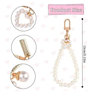 Pearl keychain detail showing the heart pearl accent, metal clasp, and overall length.