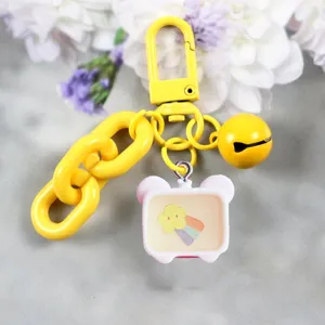 Cute cartoon TV pendant keychain with bell and thick chain, ideal fashion accessory for bags.