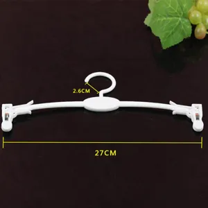 Vista ravvicinata dettagliata della gruccia per reggiseno in plastica bianca, 27cm.