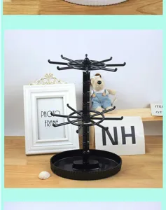 Detailed view of black rotating jewelry stand, keychain display rack and bracelet storage organizer.