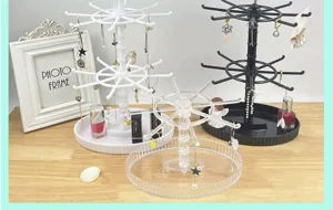 Rotating jewelry display stand for earrings, keychains, and bracelets. Acrylic desktop organizer.