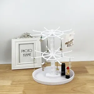 White rotating jewelry display stand multi-layer rotating rack for earrings and small items.