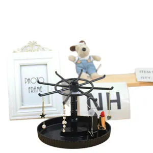 Black rotating jewelry display stand with multi-hook design for desktop organizer storage.