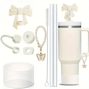 Details of Stanley tumbler silicone accessory set including bow straw cover and butterfly chain.