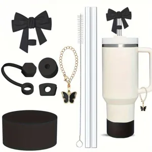 Details of Stanley tumbler accessories set including bow straw topper and butterfly chain.