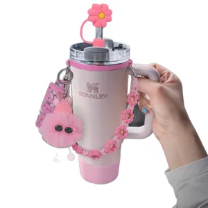 Set tazza termica Stanley rosa con copertura per cannuccia margherita e peluche