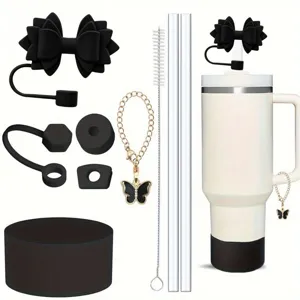 Stanley tumbler accessory set featuring black bow straw topper, glass straws, and charms.