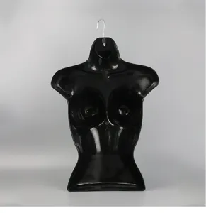 Black plastic female mannequin torso detail, hanging display prop for bras and swimwear.
