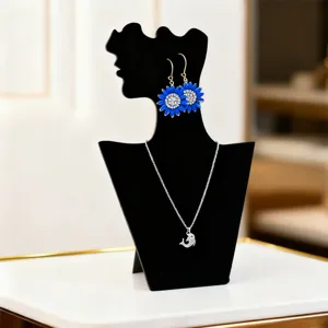 Black silhouette jewelry display stand for necklaces and earrings elegant showcase holder.