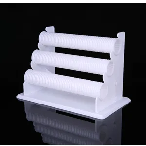 Detail view of white plastic 3-tier bracelet display stand, perfect for jewelry store counters.