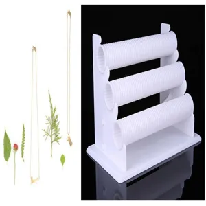 Plastic 3-tier jewelry display stand for bracelets, necklaces, and watches, counter use.