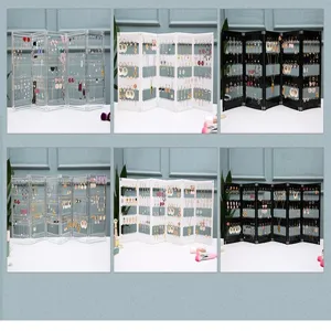 Foldable acrylic earring holder display stand panel detail showcasing multiple storage slots.