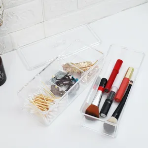 Clear acrylic makeup organizer with lid, multi-compartment storage box for cosmetics and jewelry.