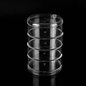 Transparent multi-layer rotating round storage box for desktop jewelry and small accessories.