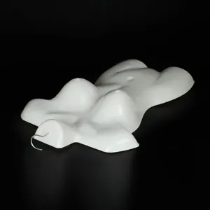 White plastic female torso mannequin form display prop for clothing lingerie retail stores.