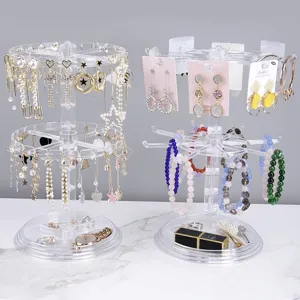 Clear acrylic rotating jewelry display stand for earrings, necklaces, bracelets and rings.