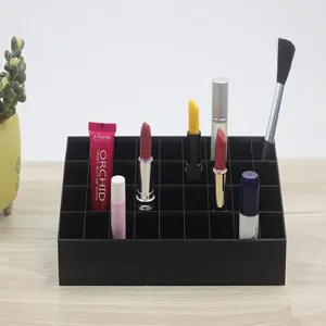 Black multi-grid makeup organizer for lipstick, lip gloss and desktop cosmetic storage.