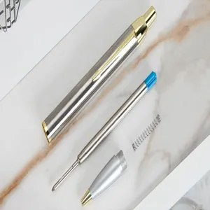 Metal push ballpoint pen detail split view with ink refill and spring components