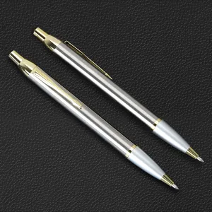 Metal retractable ballpoint pens set in silver and gold tone for business office stationery.