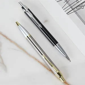 Detailed view of luxury metal click ballpoint pens with classic arrow clip design.