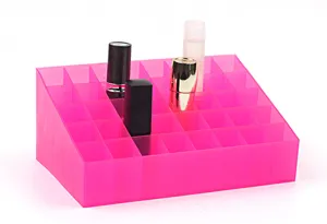 Detailed view of the pink 40-grid acrylic cosmetic organizer, lipstick display shelf unit.