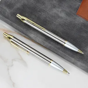 Classic metal click ballpoint pens with silver body and gold clip for business office use.